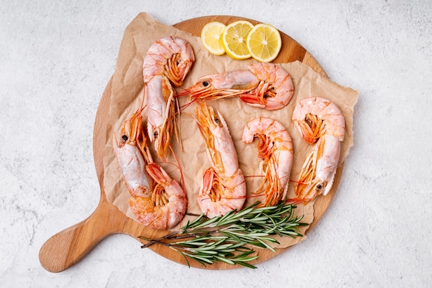 Delicious shrimps on wooden board