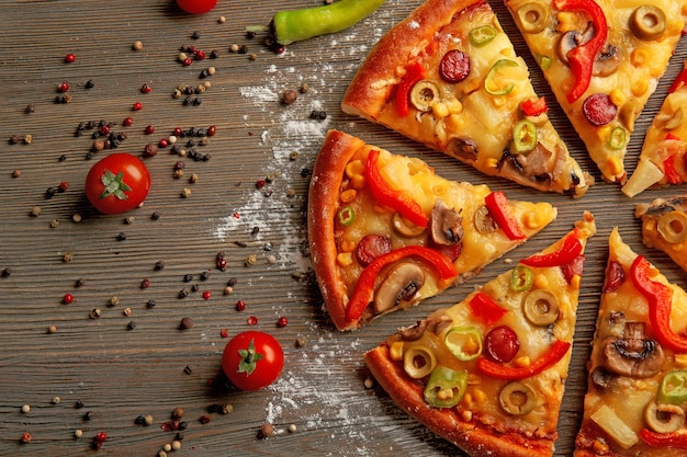 Delicious sliced pizza with vegetables closeup