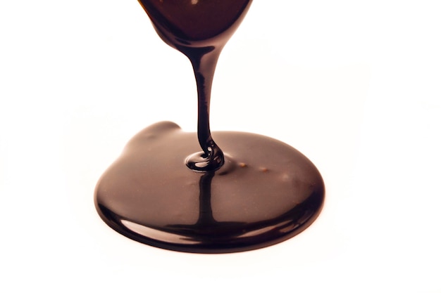 Delicious smooth chocolate sauce flowing chocolate sauce