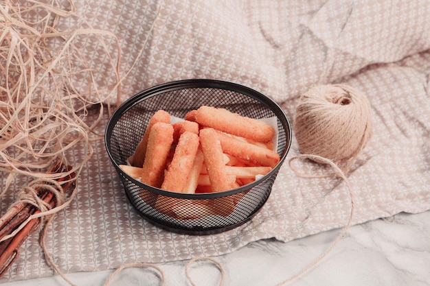 Delicious snack plate, french fries, onion rings, spring rolls
or sausages on the table