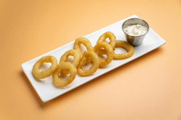 Delicious snacks in the restaurant. on an orange background