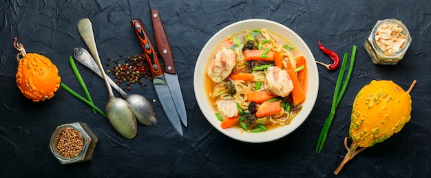 Delicious soup with chicken, pumpkin and broccoli.Asian food.