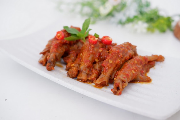 delicious spicy chicken feet as a background
