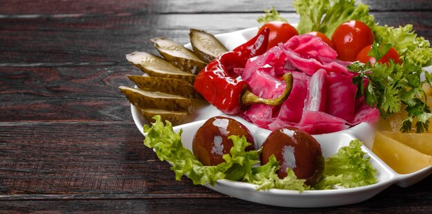 Delicious spicy pickles cut on a serving plate