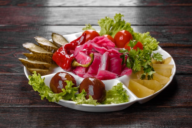 Delicious spicy pickles cut on a serving plate