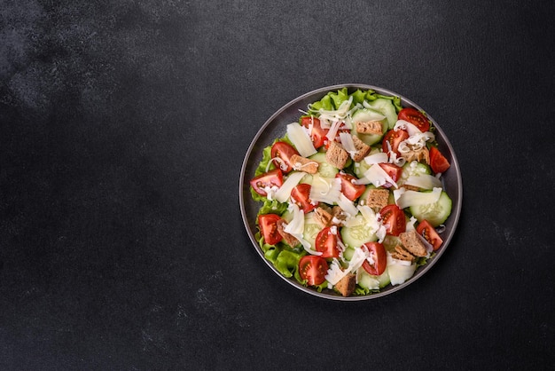 Delicious spring fresh vegetable salad with cherry tomatoes cucumber breadcrumbs and parmesan cheese