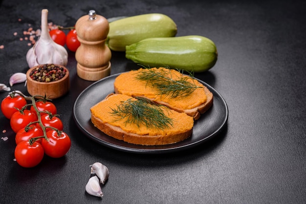 Delicious squash caviar sandwiches on a dark concrete\
background healthy breakfast