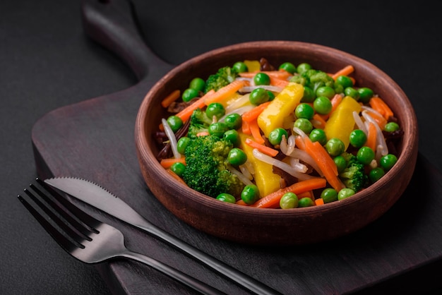 Delicious steamed vegetables broccoli mushrooms peas carrots and onions