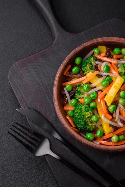 Delicious steamed vegetables broccoli mushrooms peas carrots and onions