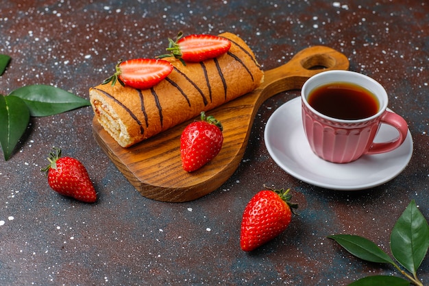 Delicious strawberry cake roll with fresh strawberries,top view