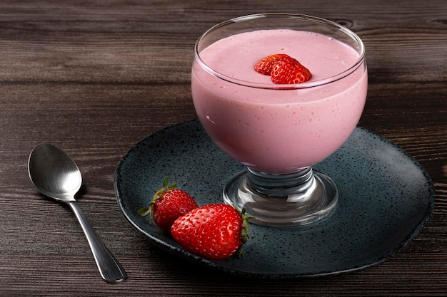 Delicious strawberry mousse in glass goblet.