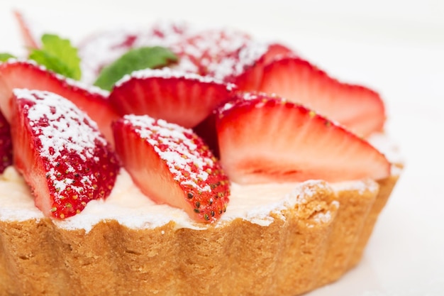 Delicious strawberry shortcake with whipped cream and fresh mint Macro Photo can be used as a whole background