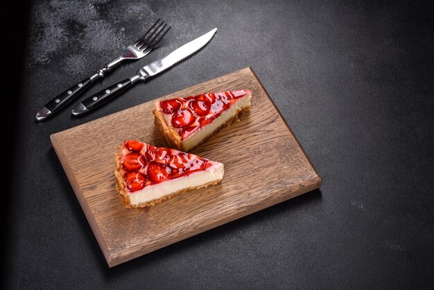 Delicious strawberry tart on concrete background top view copy space