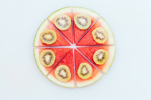 Delicious summer dessert. Watermelon pizza with slices of kiwi