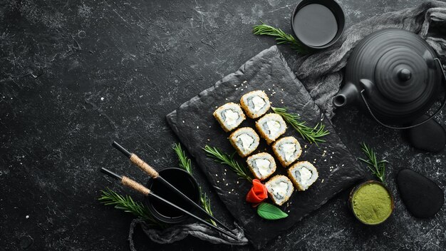 Delicious sushi with cheese and sesame Japanese cuisine Top view