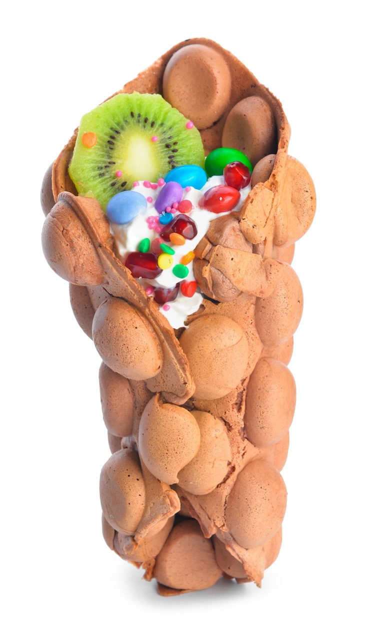 Photo delicious sweet bubble waffle on white