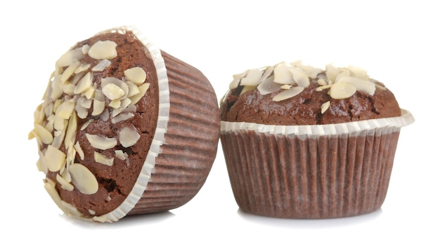 Delicious, sweet chocolate muffins, with almond petals on a white isolated background.