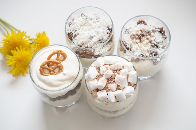 Delicious sweet dessert with cream in a glass on a light background a beautiful breakfast