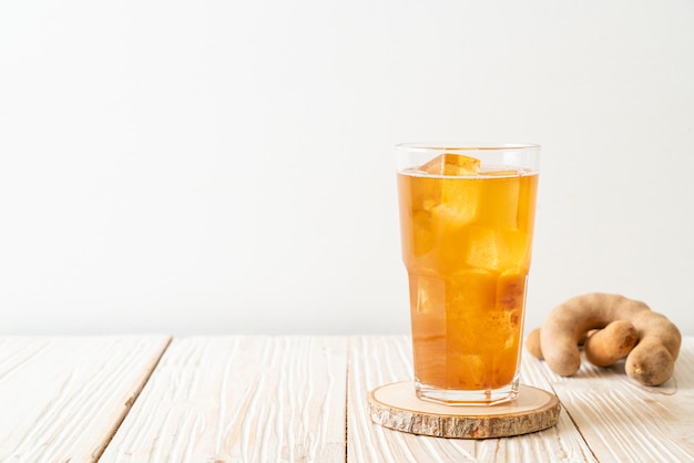 Delicious sweet drink tamarind juice and ice cube - healthy drink style