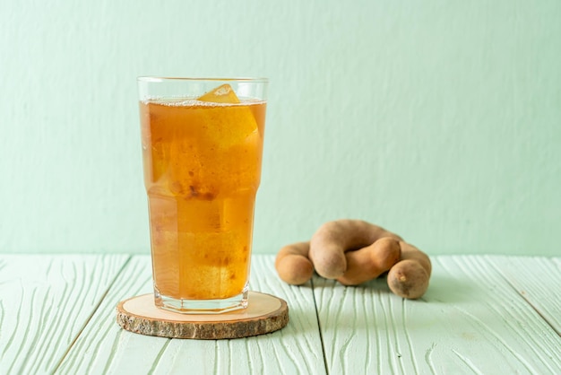 Delicious sweet drink tamarind juice and ice cube  healthy drink style