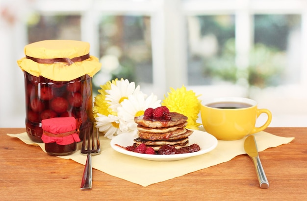 Delicious sweet pancakes on bright background