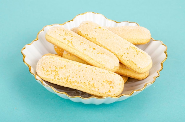 Delicious sweet and savory cookies on blue background. Studio Photo