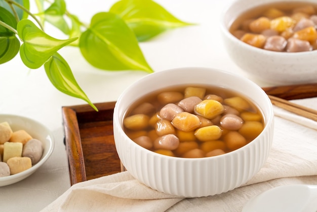 Delicious sweet taro ball soup in a white bowl for serving