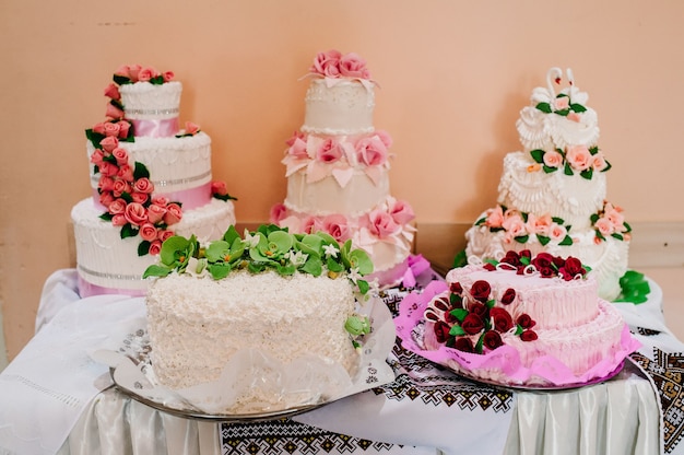 A delicious sweet wedding loaf, cake in the ukrainian style on\
embroidered towels