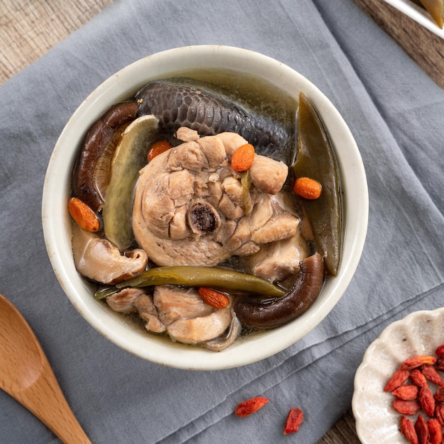 Delicious Taiwanese peeled green chili pepper chicken soup with mushroom and goji berry