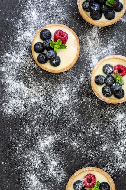 Delicious tartlets with raspberries and blueberries