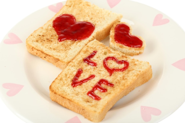 Delicious toast with jam on plate close-up