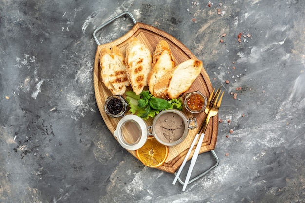 Photo delicious toasted bread with liver pate crostini with red onion jam, assorted italian appetizer bruschetta. banner, menu, recipe place for text, top view.