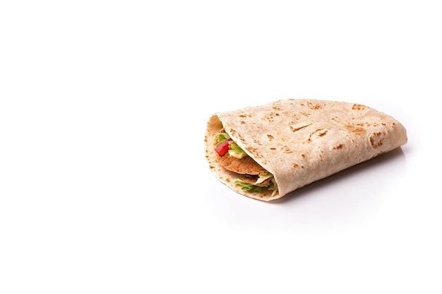 Delicious tortilla with meat and vegetables isolated on white background with copy space