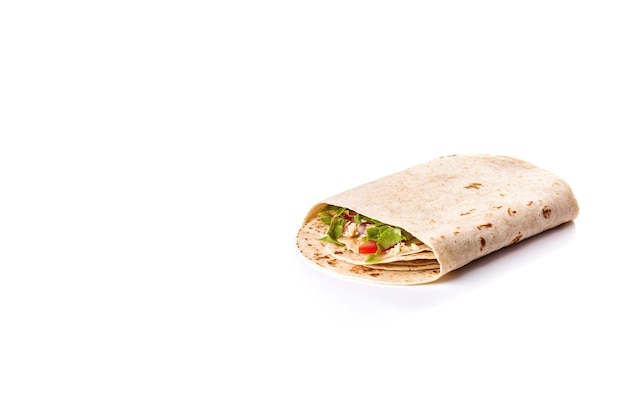 Delicious tortilla with meat and vegetables isolated on white background with copy space