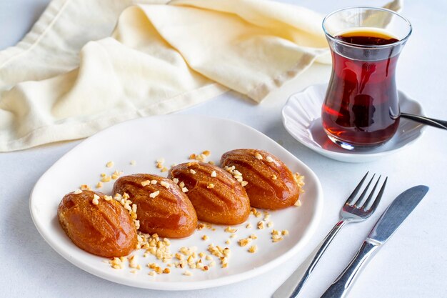 Delicious turkish sweet sekerpare on served Traditional Turkish dessert sekerpare on a white background