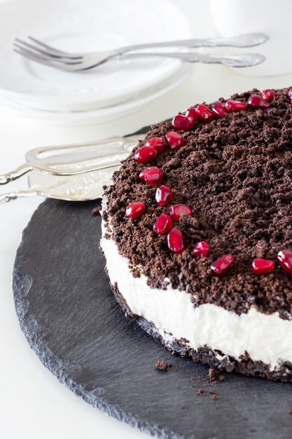 Delicious vanilla chocolate cheesecake. Slate plate.