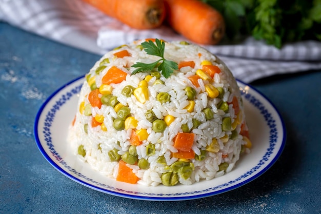 Delicious vegetable rice pilaf with green peas, carrots and sweet corn (Turkish name; sebzeli pilav)