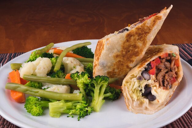 Delicious vegetarian food with vegetables tortillas carrot cucumbers tomato