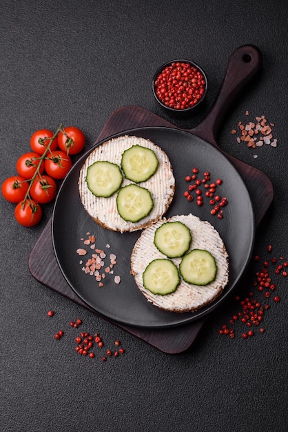 Delicious vegetarian sandwich with grilled toast cream cheese cucumbers and seeds