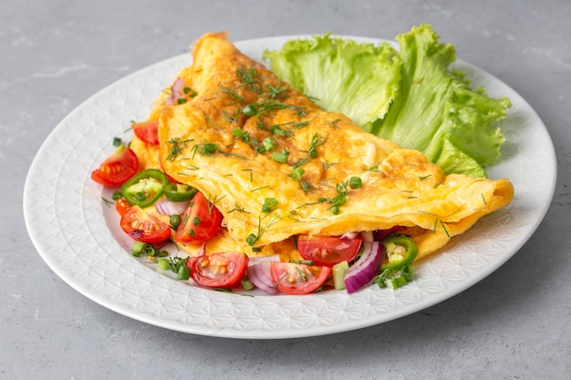 Delicious veggie omelet served on a plate