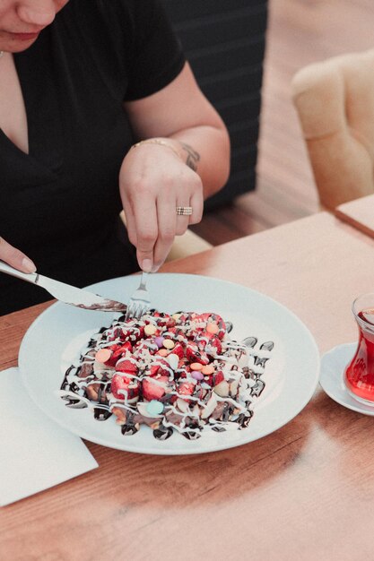 Delicious waffle with chocolate sauce 