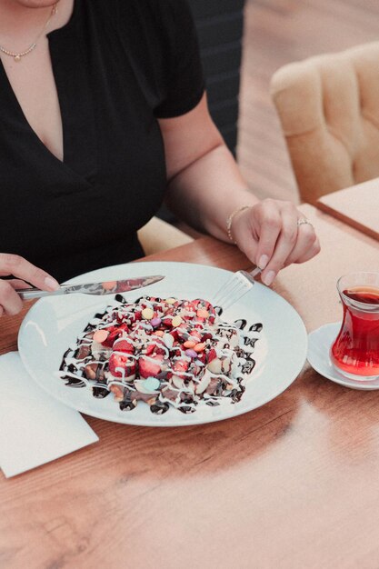 Delicious waffle with chocolate sauce