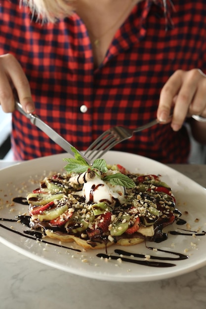 Delicious waffle with chocolate sauce