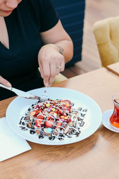 Delicious waffle with chocolate sauce