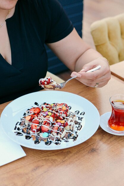 Delicious waffle with chocolate sauce