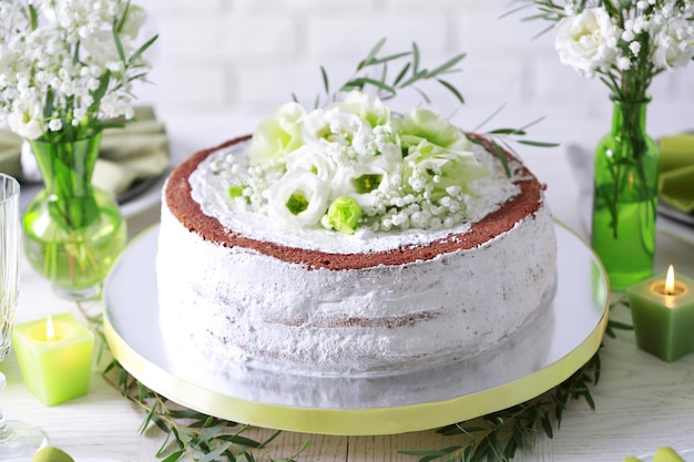 Delicious wedding cake on beautifully served table closeup