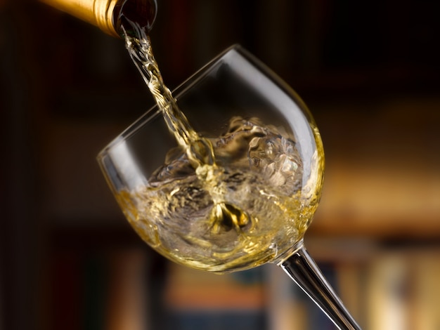 delicious white wine poured into a glass