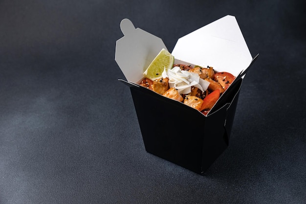 Delicious wok noodles box container . Chinese and asian takeaway fast food.