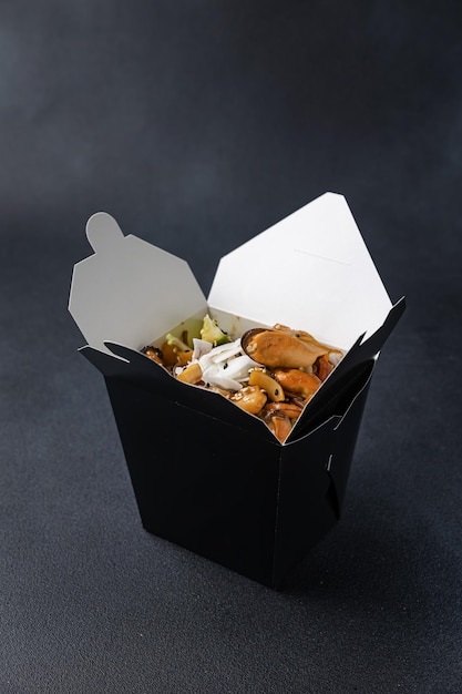 Delicious wok noodles box container . Chinese and asian takeaway fast food.