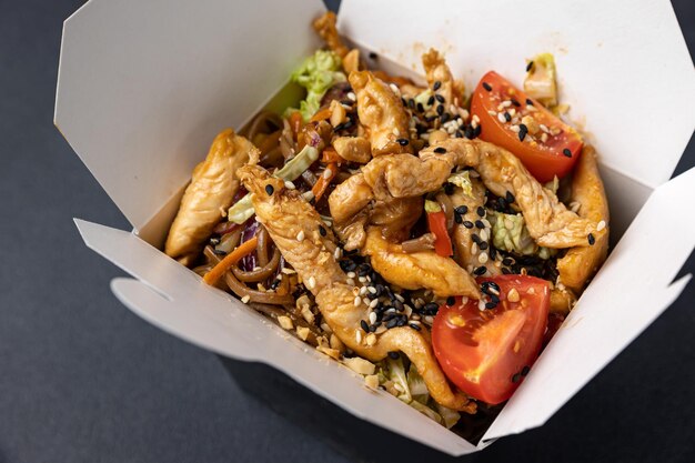 Delicious wok noodles box container. Chinese and asian takeaway fast food.